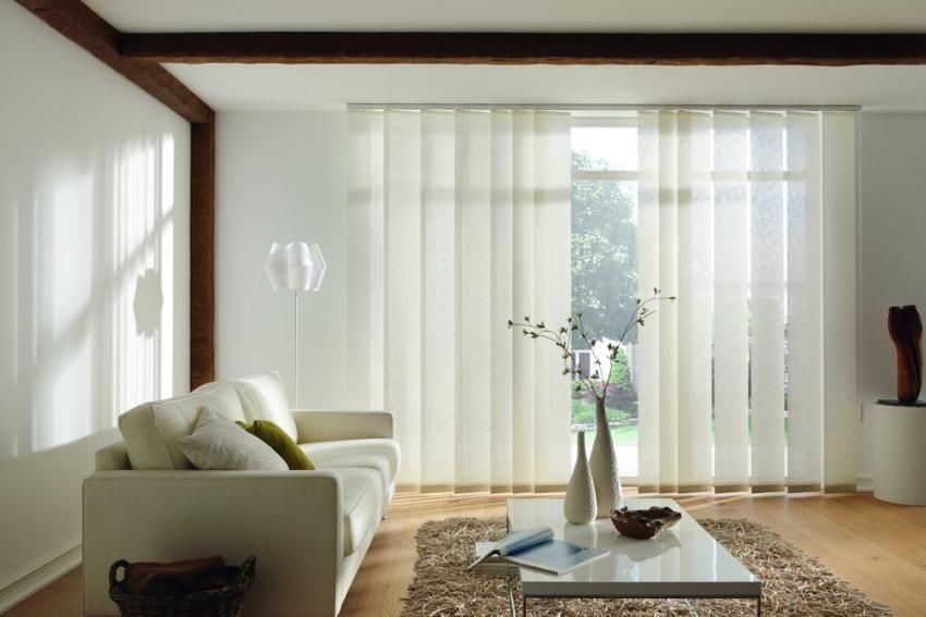 Vertical fabric blinds on the windows: reliable and durable sun protection
