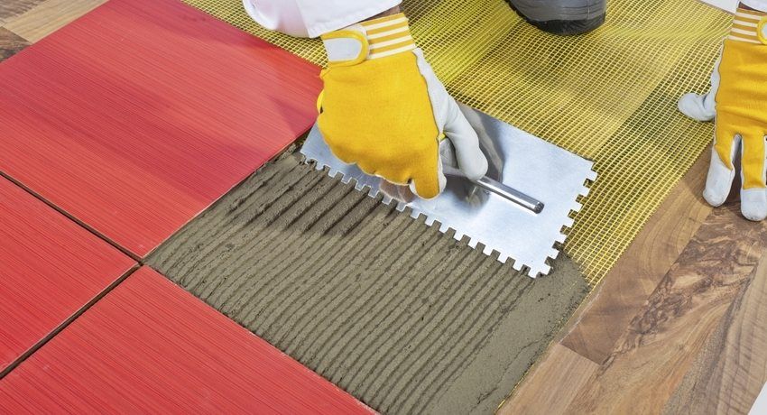 How to lay tiles on a wooden floor: details of technology and recommendations