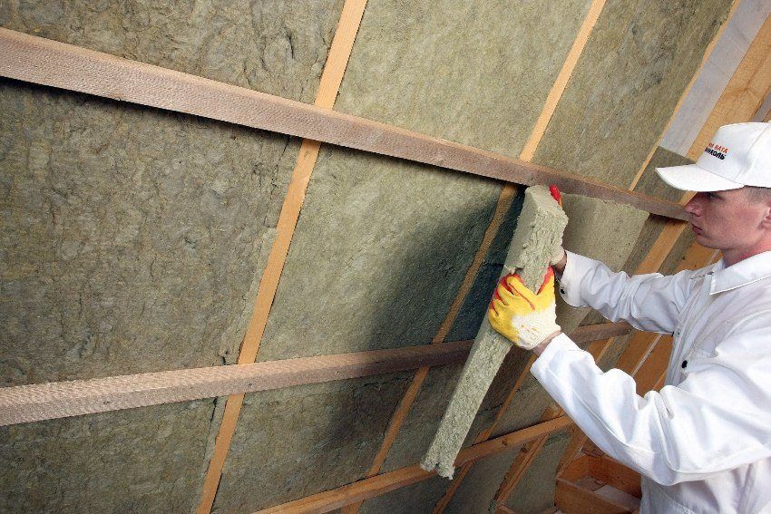 Installation of insulation for walls inside the house in the country